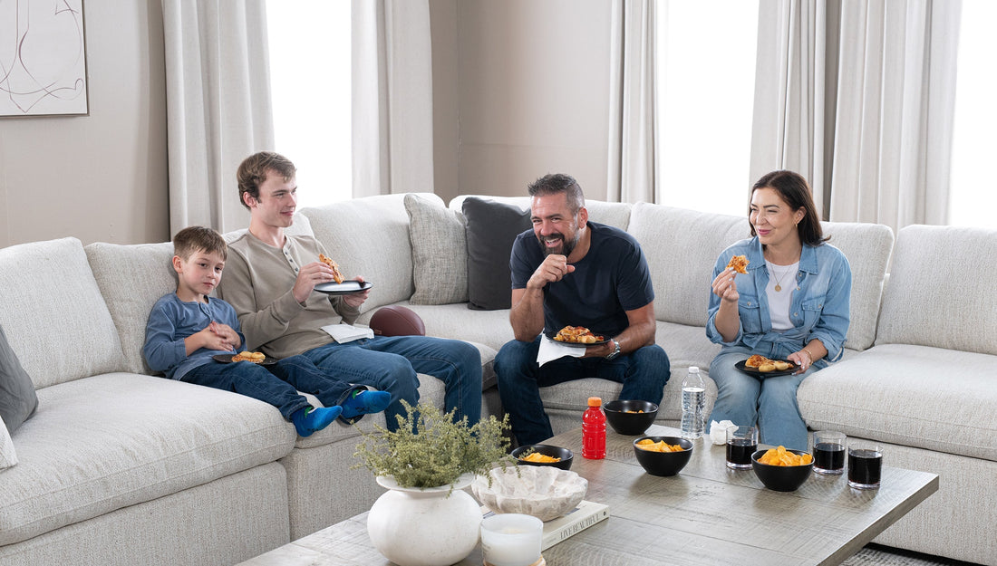 Family watching a football game in the living room